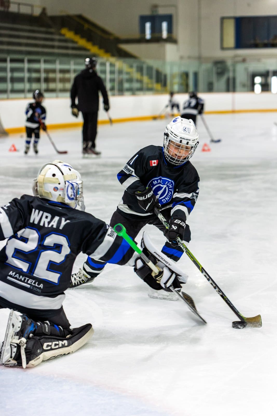 A skater breaks in alone and the goaltender comes out to challenge