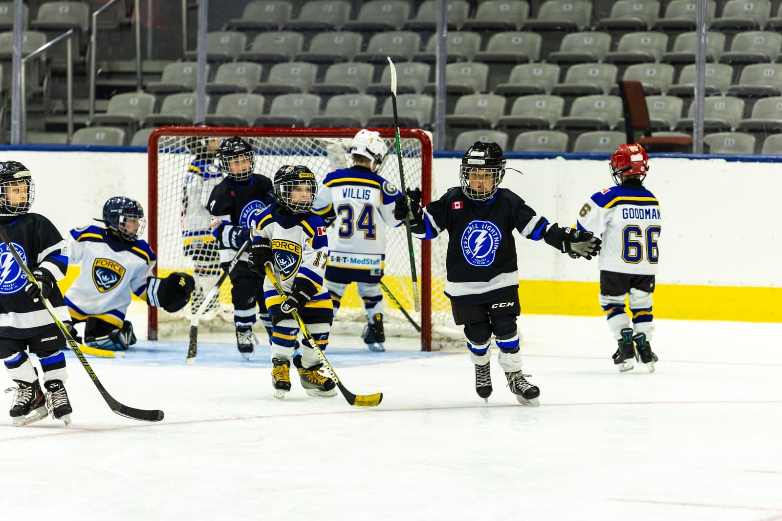 Teammates converge on the net in celebration