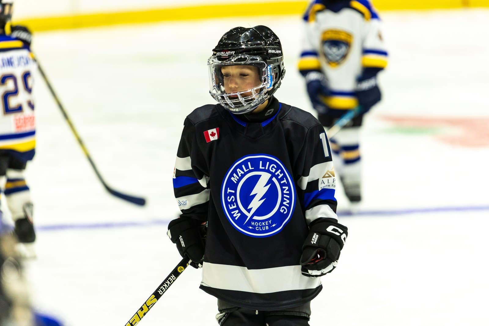 A skater lifts their head mid-rush, looking for a passing option