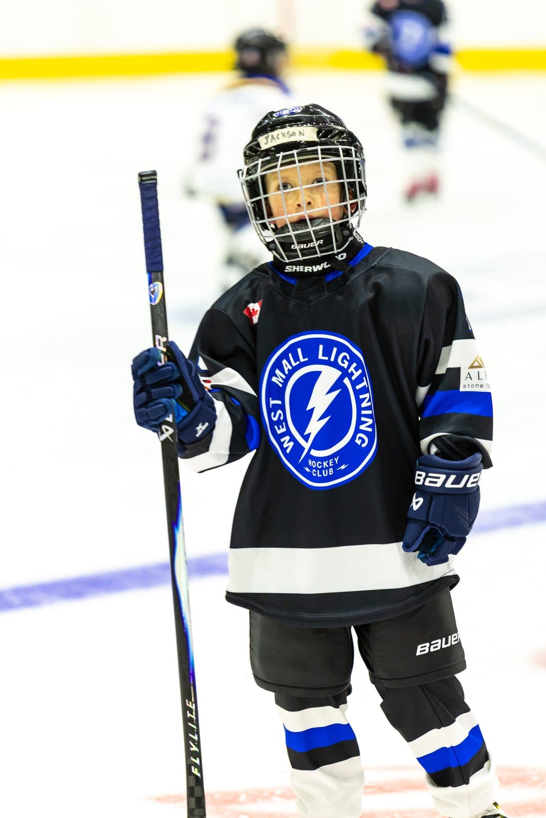 A player stands with stick in hand, ready for the drill to start