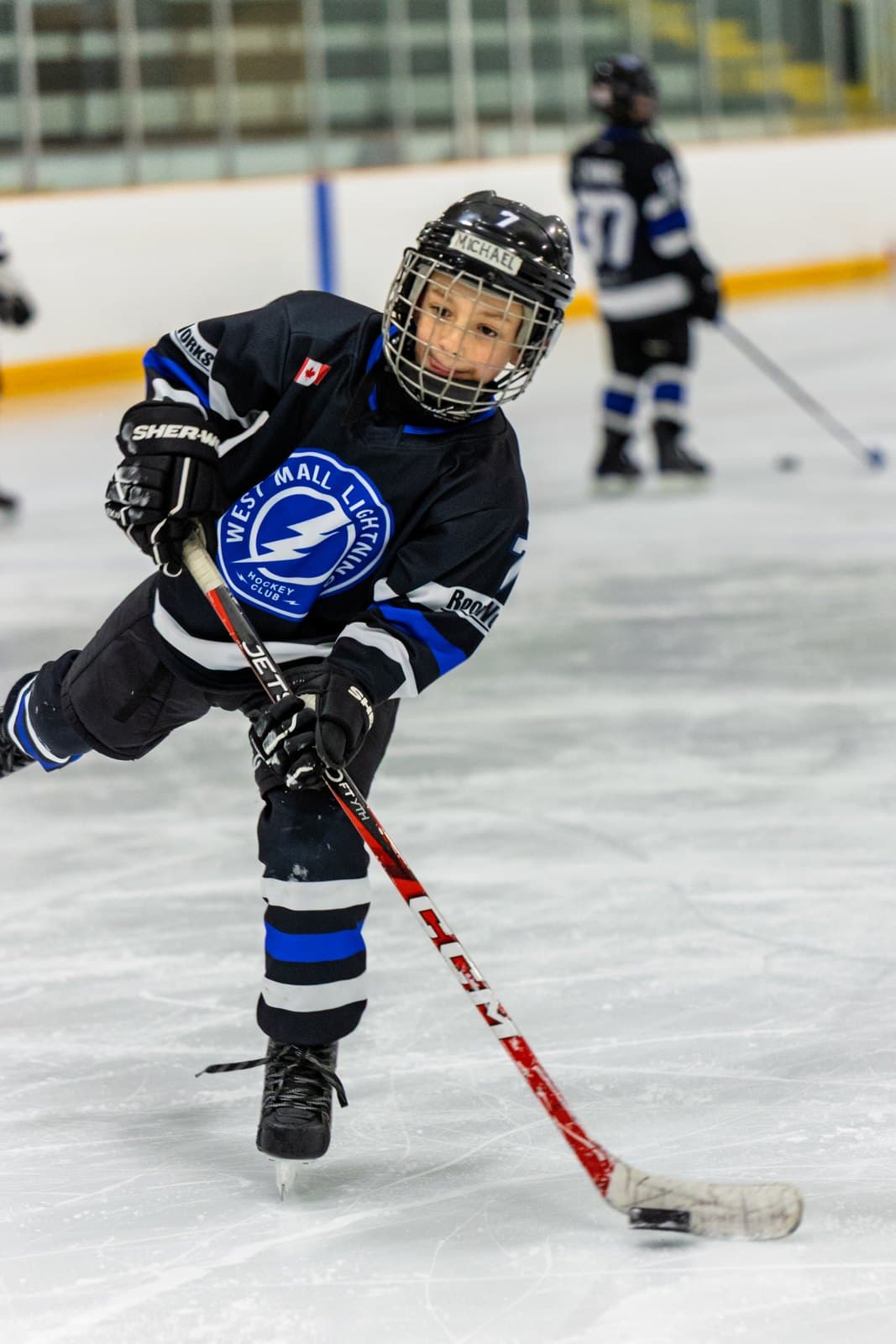 A player turns with the puck, blade cupped over it